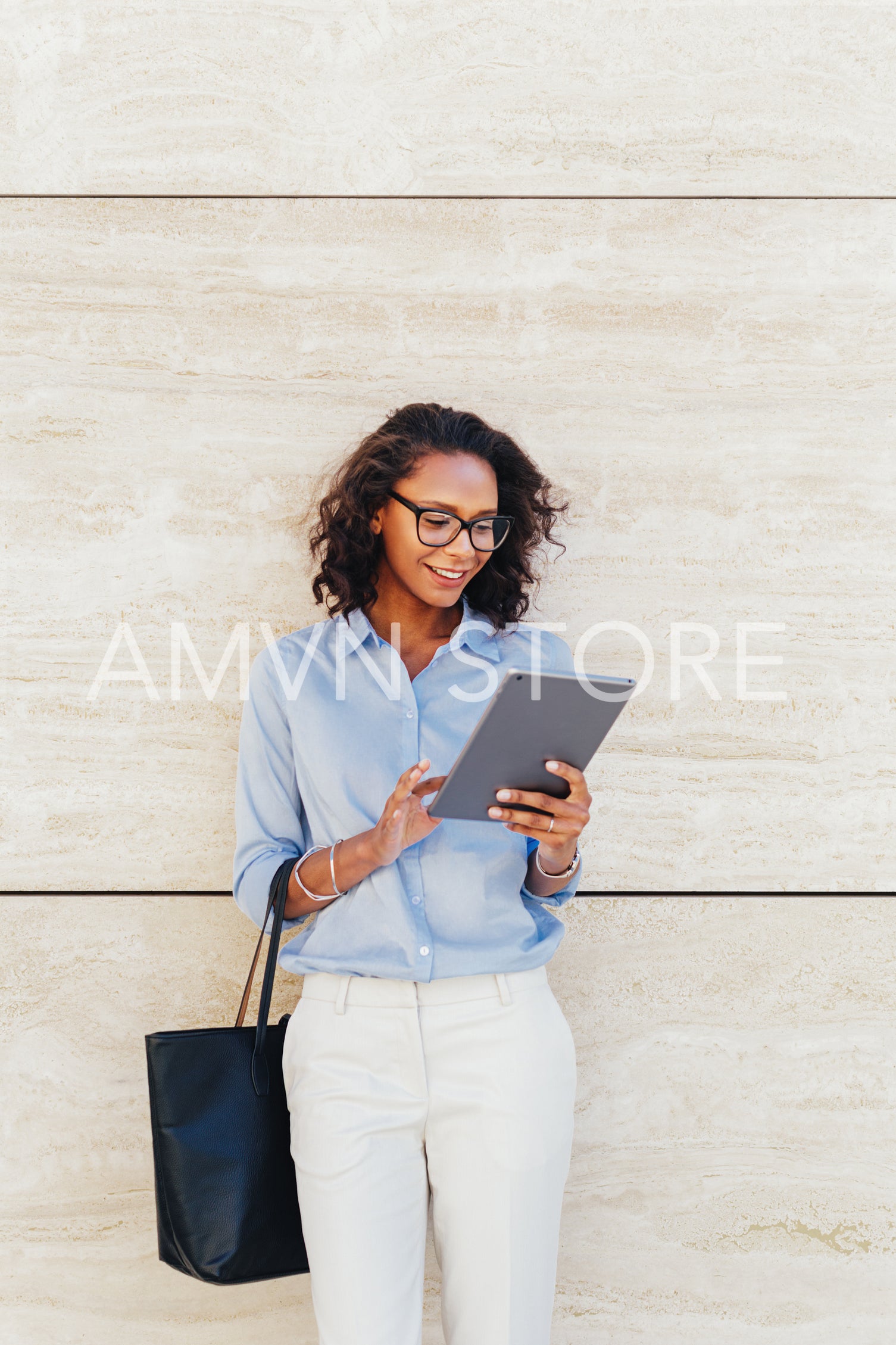 Woman reading from digital tablet	