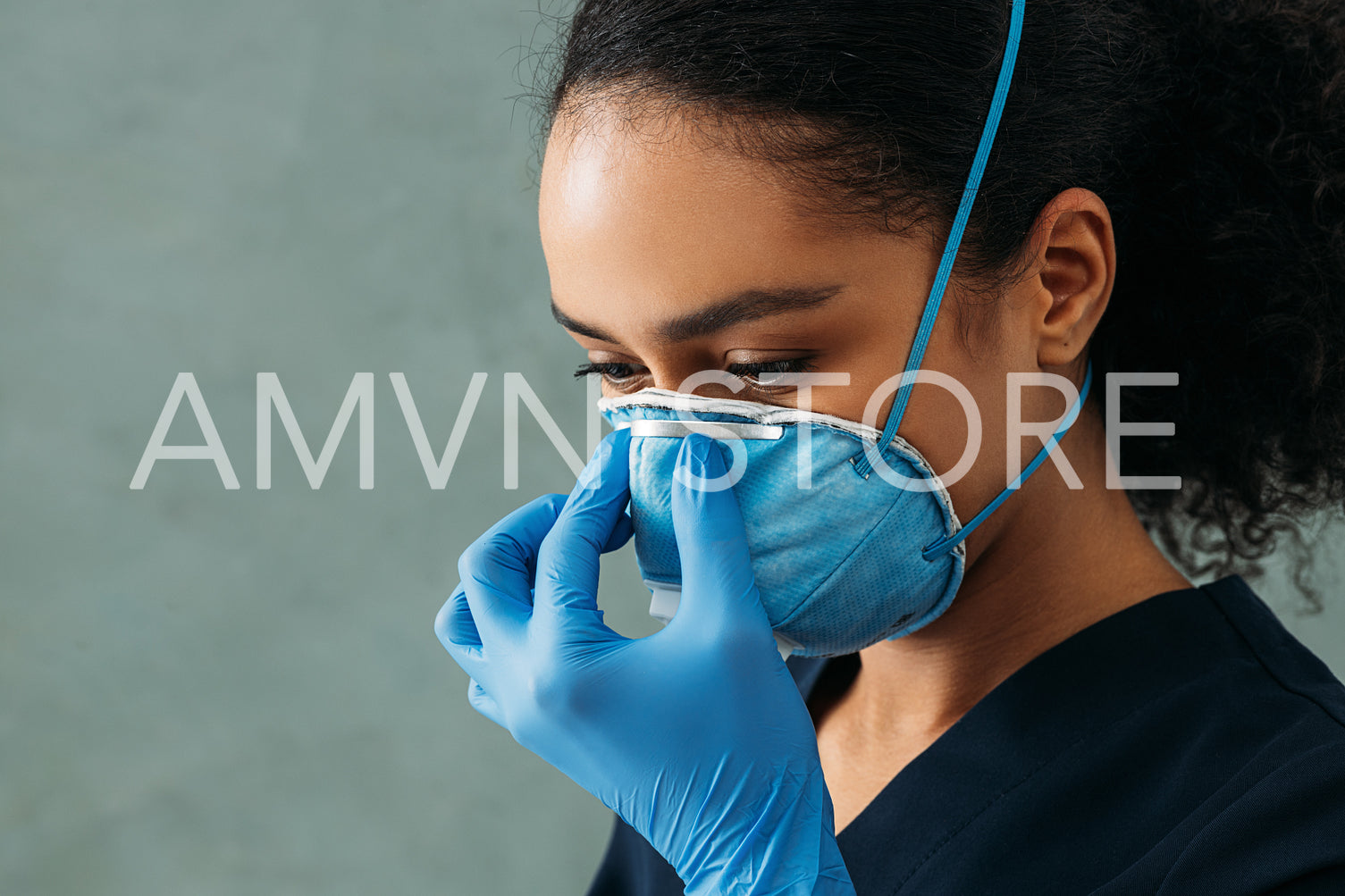 Close up of young medical specialist wearing a respirator	