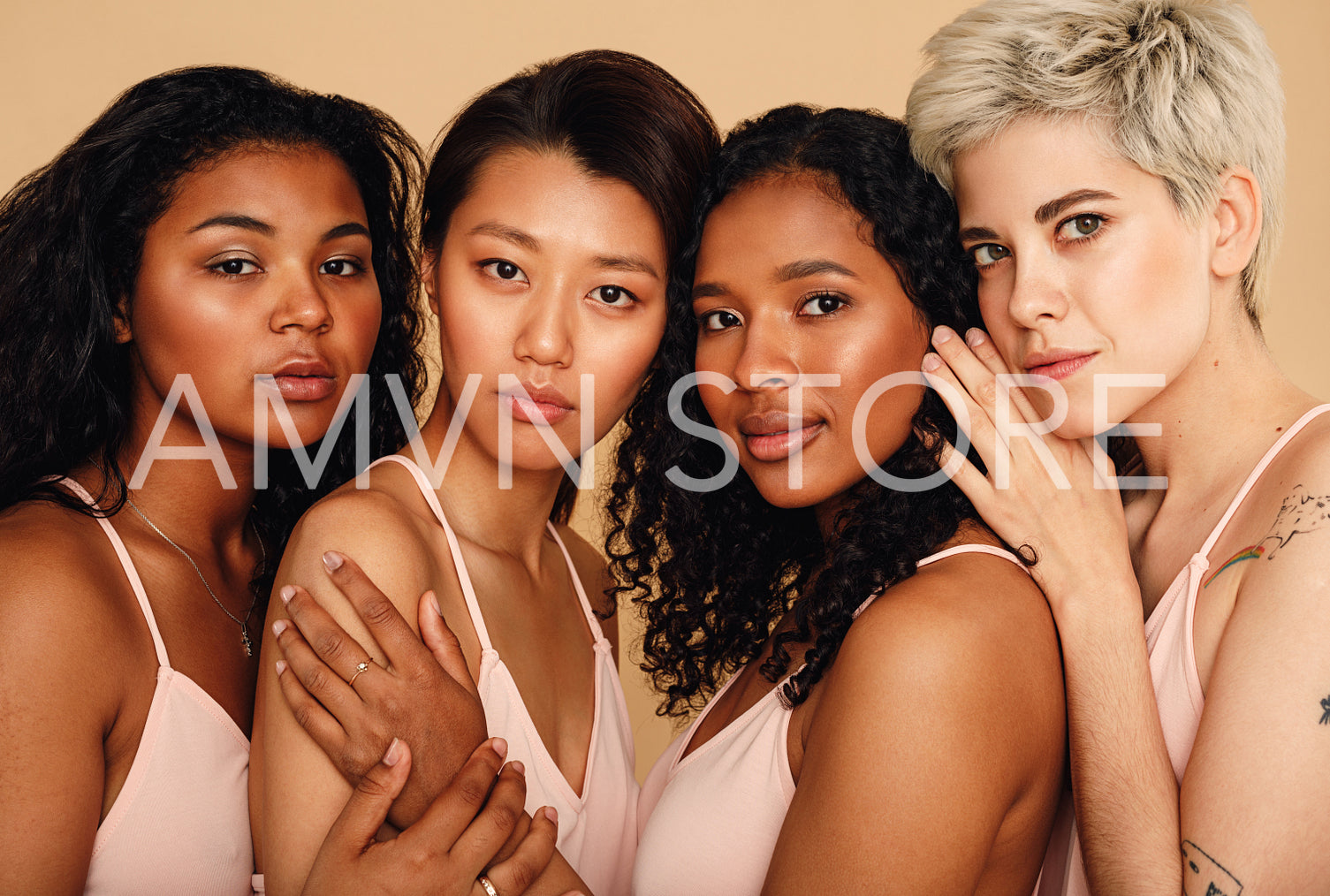 Studio portrait of four women looking at camera	