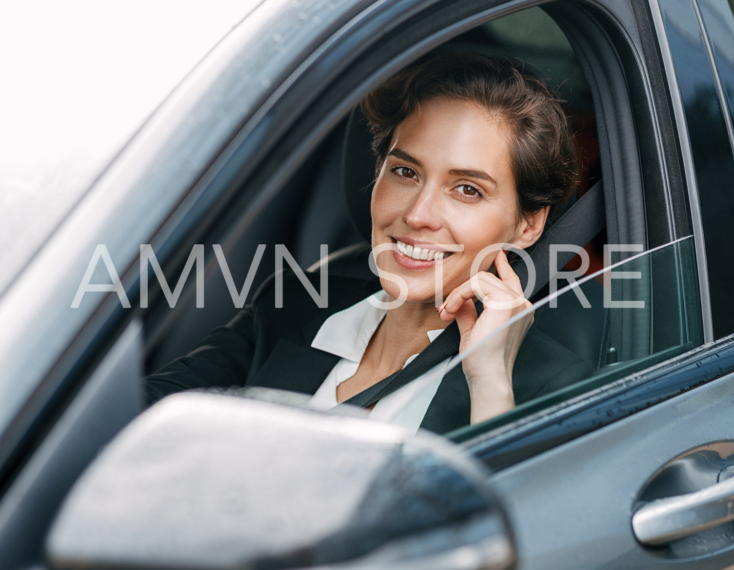 Beautiful business lady looking at camera. Young woman looking out of the window.	