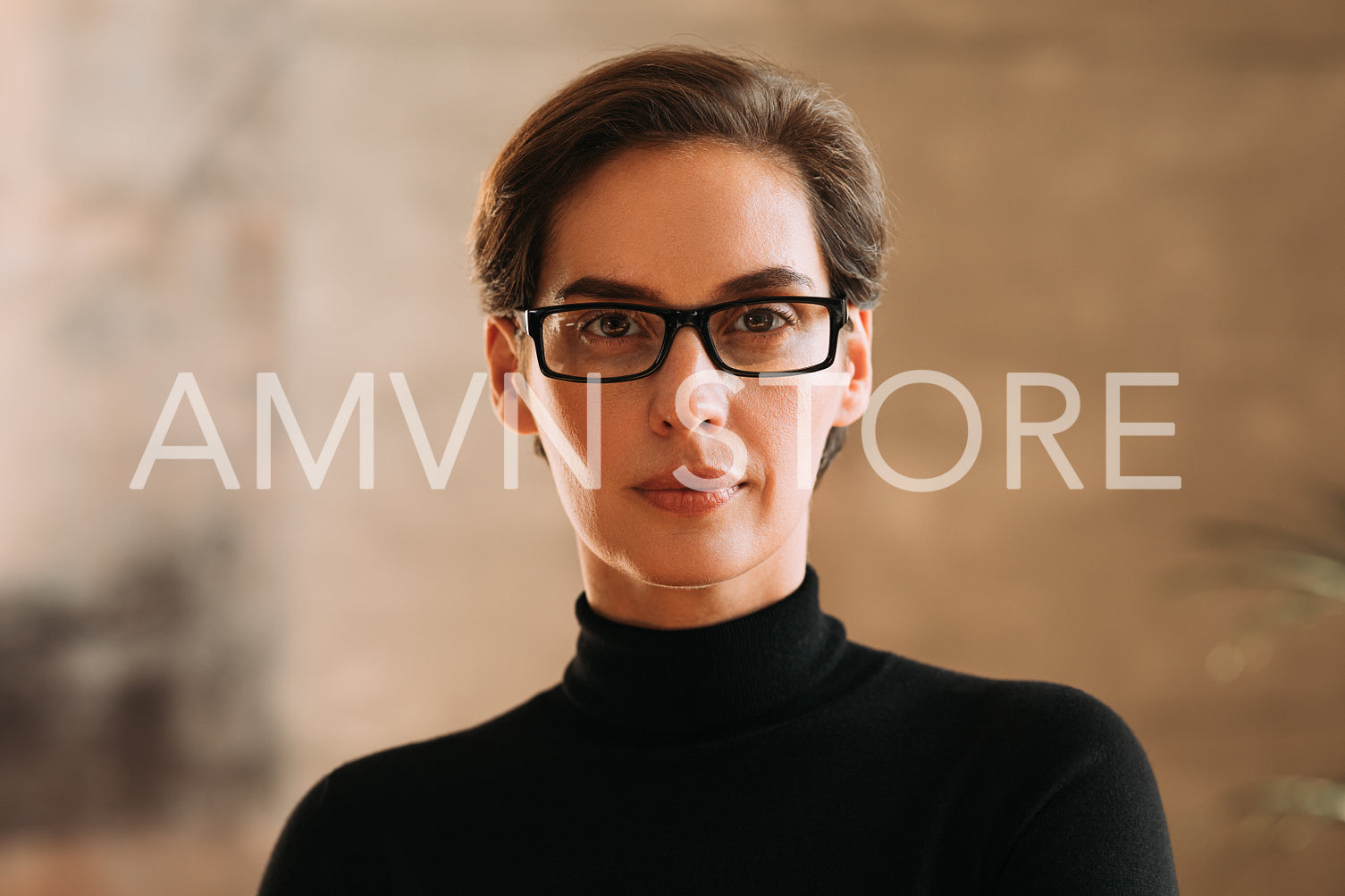 Portrait of an adult businesswoman in eyeglasses.  Confident woman working in CEO position in a company looking at camera.