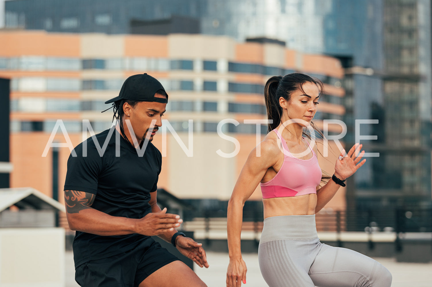 Young athletes doing warming-up exercises on the rooftop