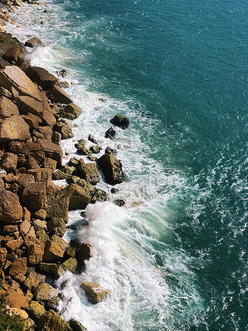 View from above on the ocean with waves and coastline