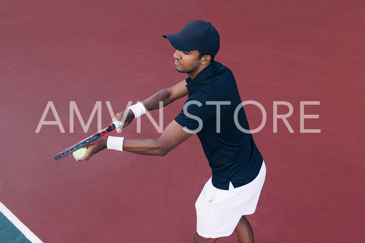 Tennis player preparing to serve a tennis ball during a tennis match