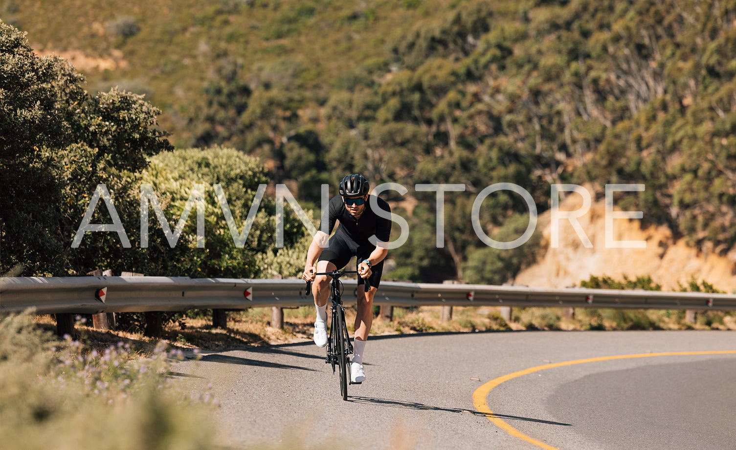 Fit cyclist doing an intense ride on an empty mountain road