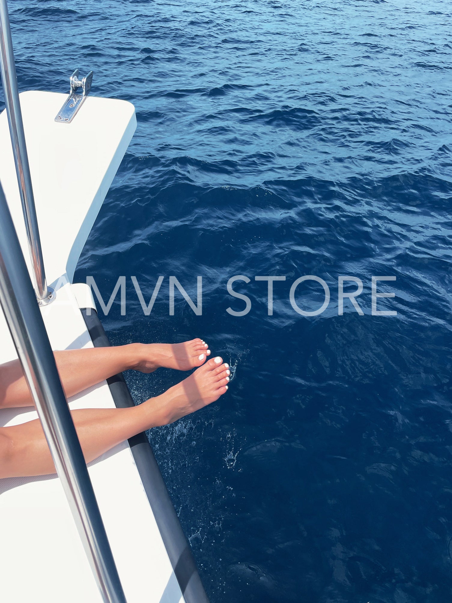 Cropped shot of a woman legs above a water on a yacht