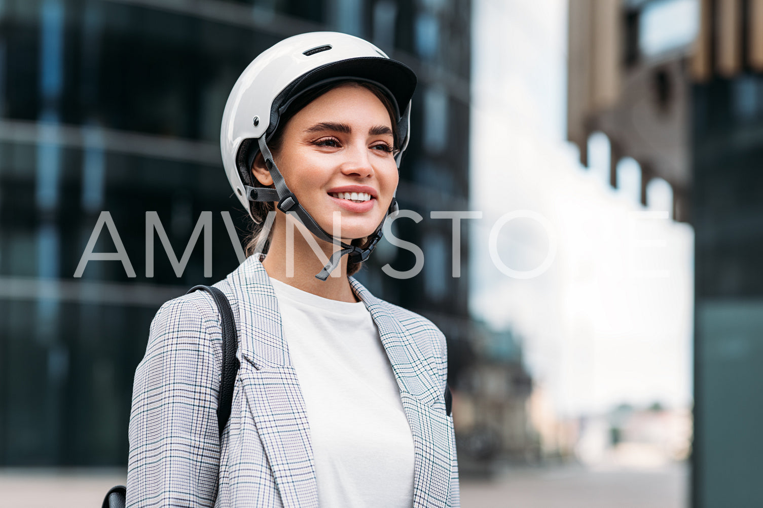 Portrait of a beautiful smiling businesswoman with a white safety helmet on head