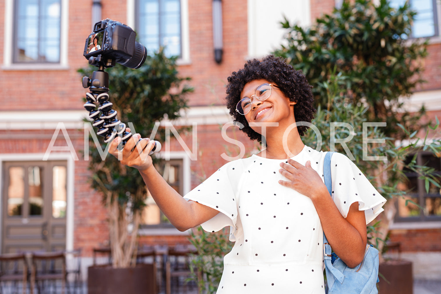 Girl vlogger recording content on a digital camera	