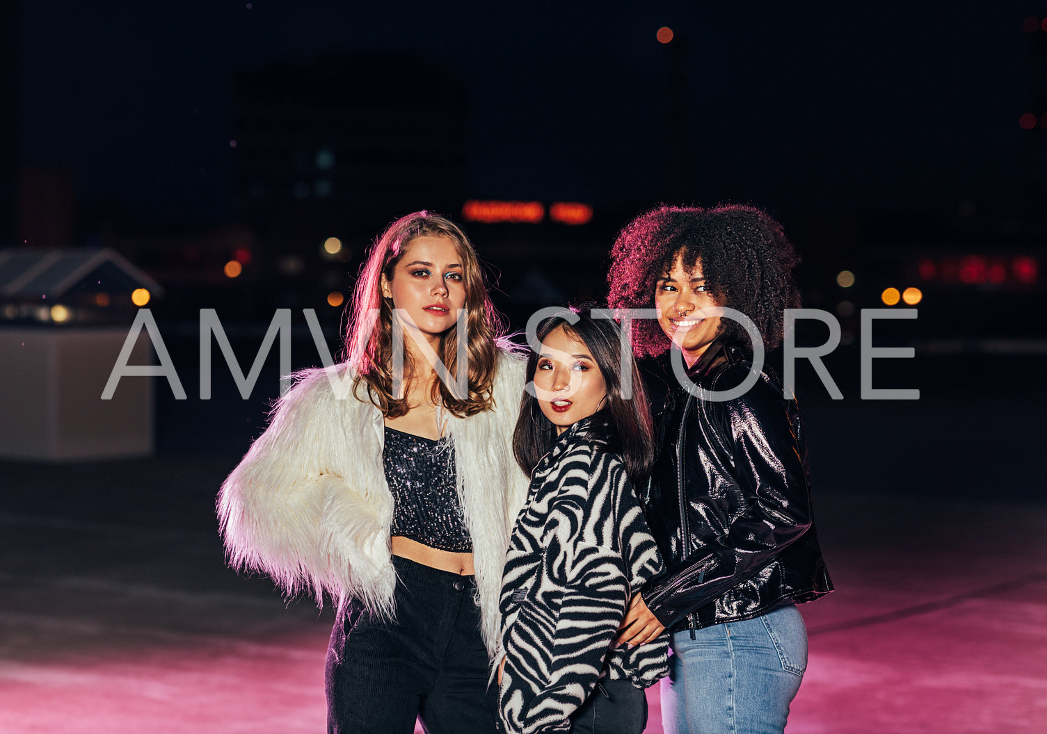 Three beautiful gilrs standing on roof at night and looking away