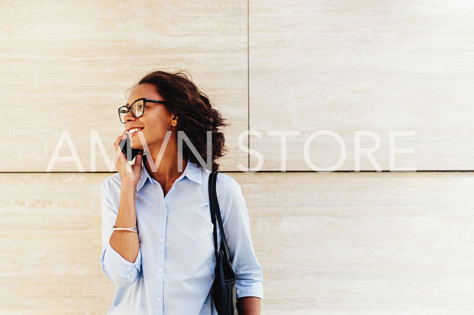 Beautiful businesswoman in formal clothes making a phone call	