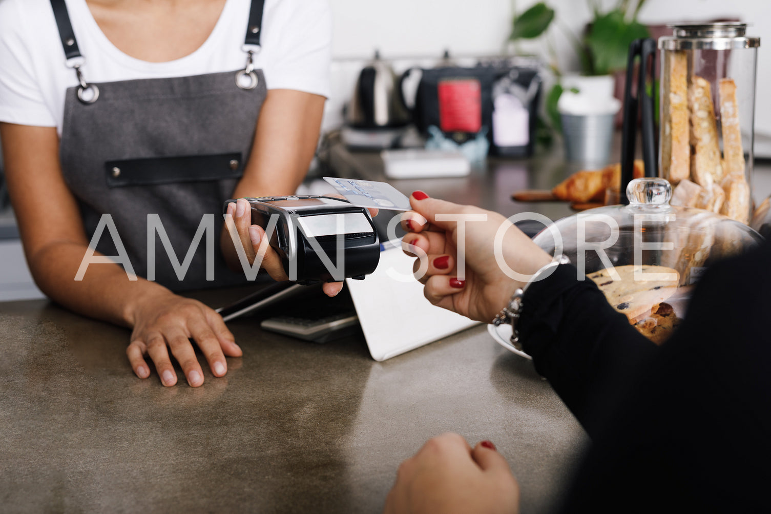 Customer making wireless payment using credit card with nfc technology	