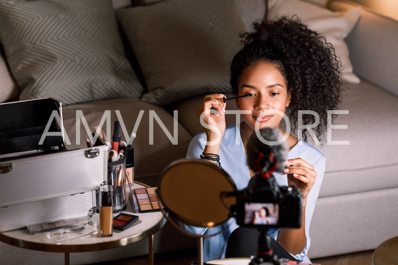 Beauty vlogger applying cosmetics on her eye	