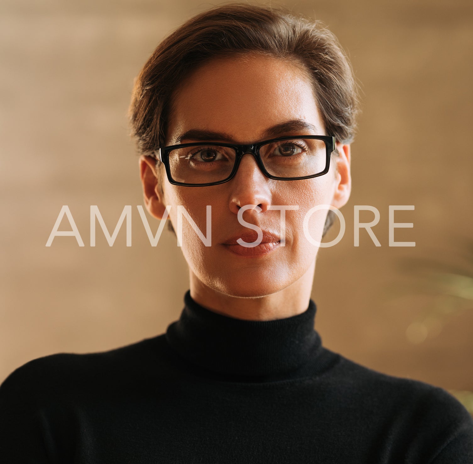 Close-up portrait of a confident businesswoman with short hair wearing eyeglasses looking straight into a camera 