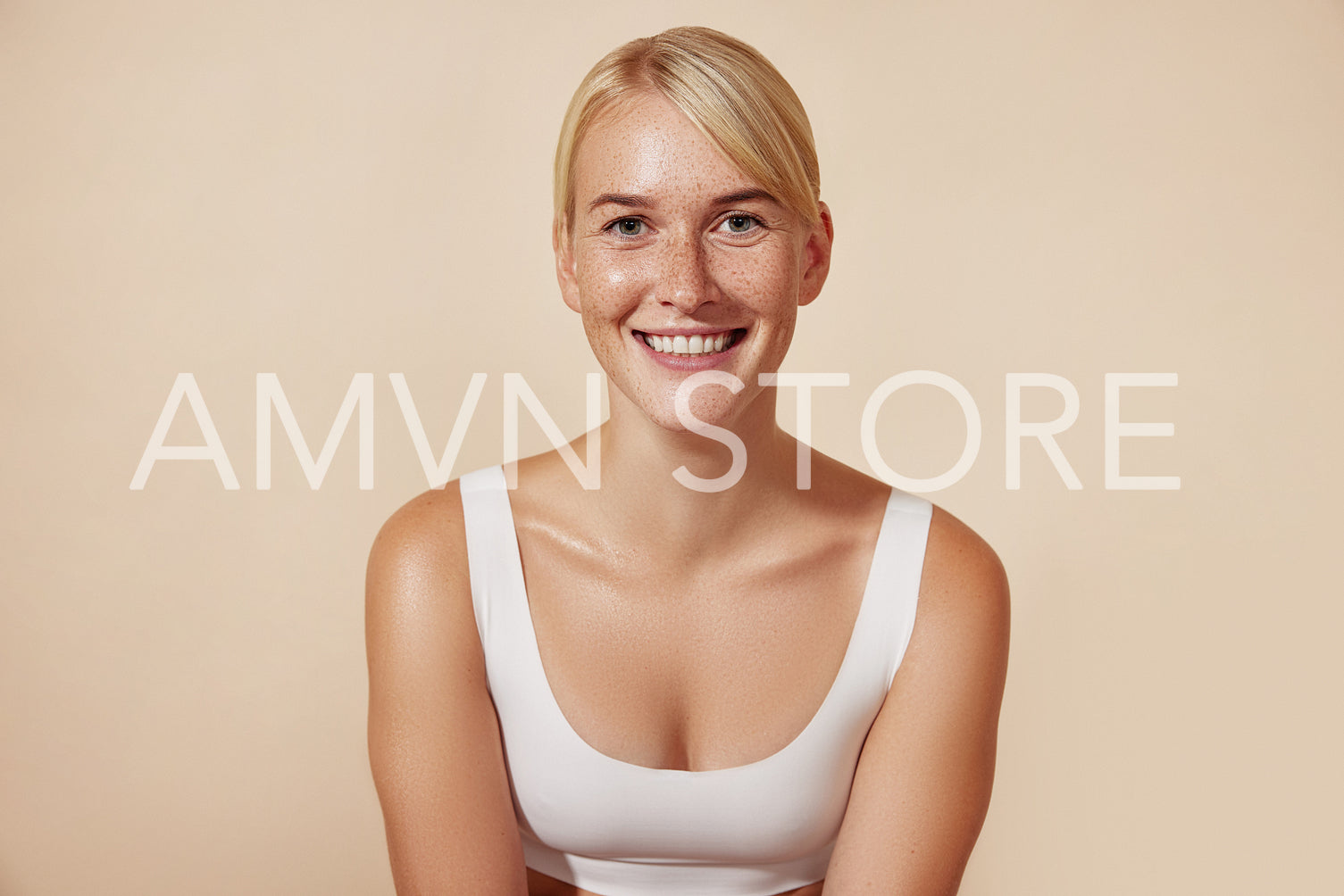 Young cheerful woman with freckles. Portrait of a smiling female with perfect skin.