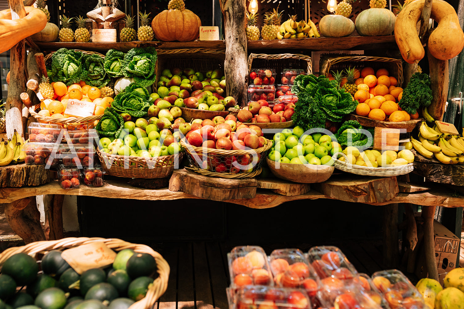 Farmer's market stall with a lot of vegetables and fruits. Local outdoor market on a sunny day.