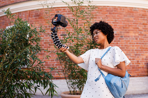 Tourist woman filming content for her blog