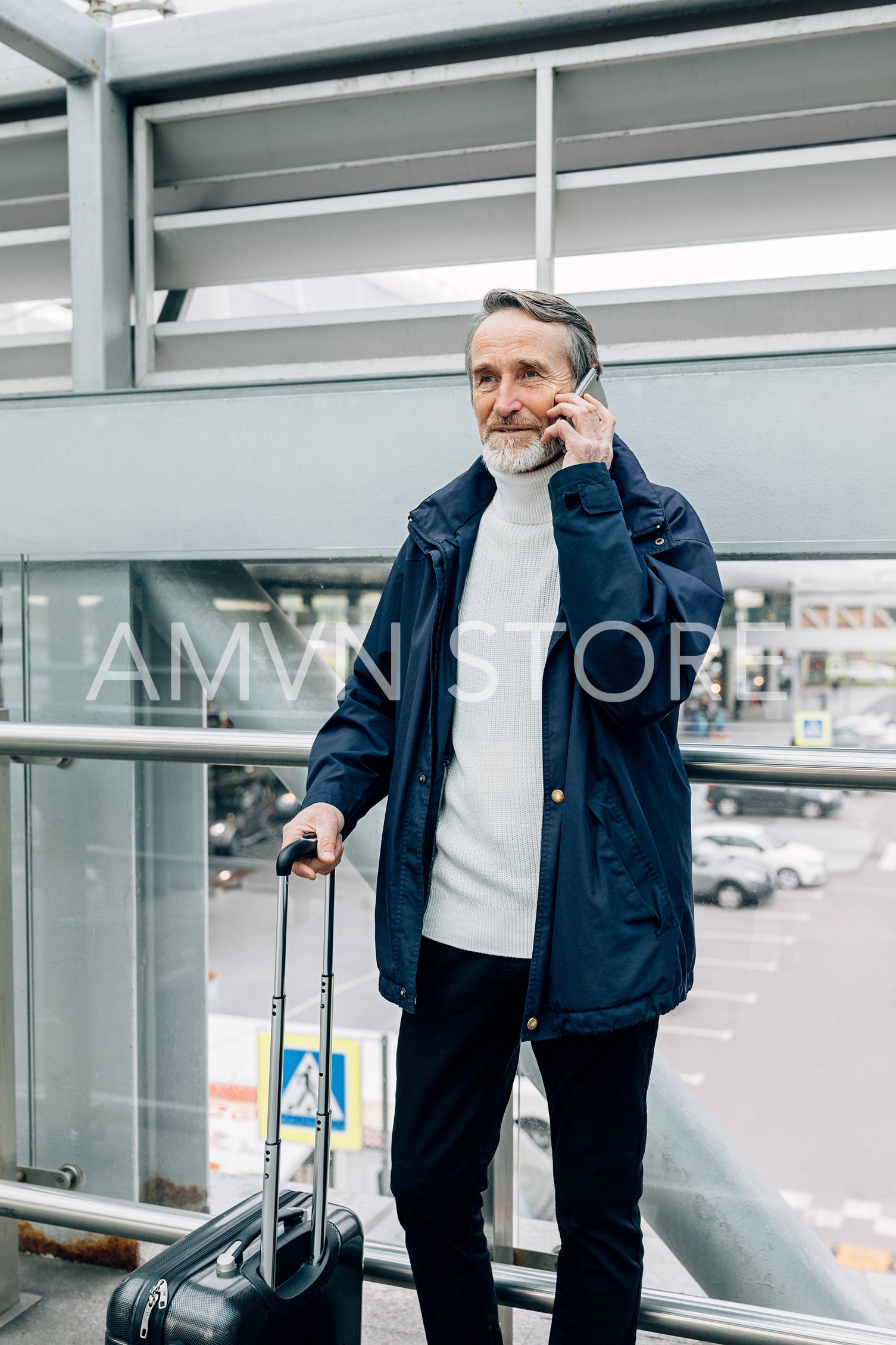 Senior man using mobile phone in the city	