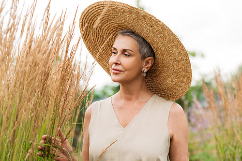 Aged woman in a straw hat