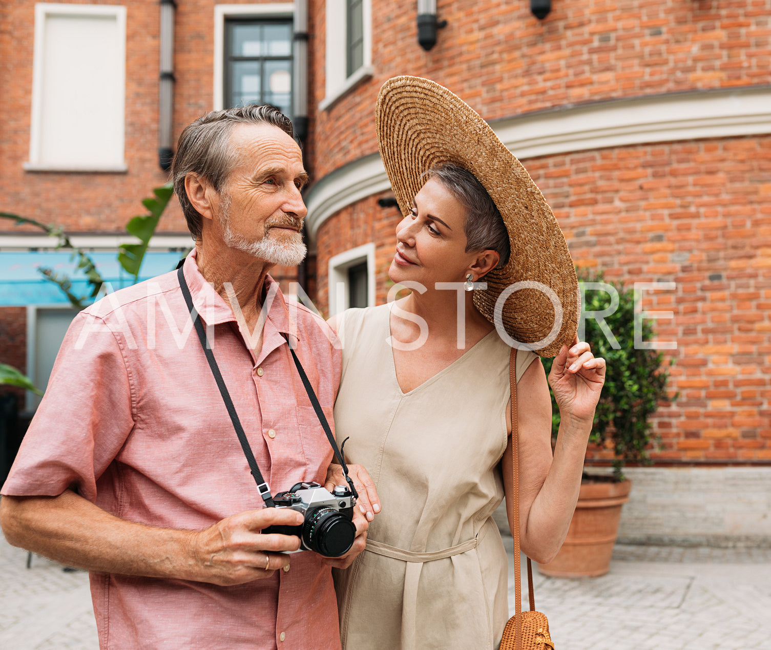 Senior couple walking in the city. Two aged people are on vacation.