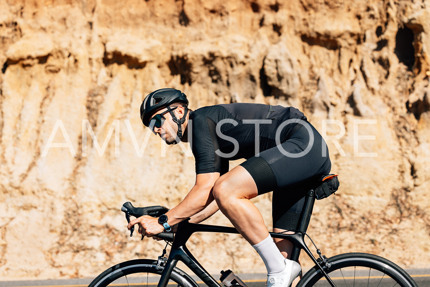 Bicycle rider in helmet and goggles exercising outdoors