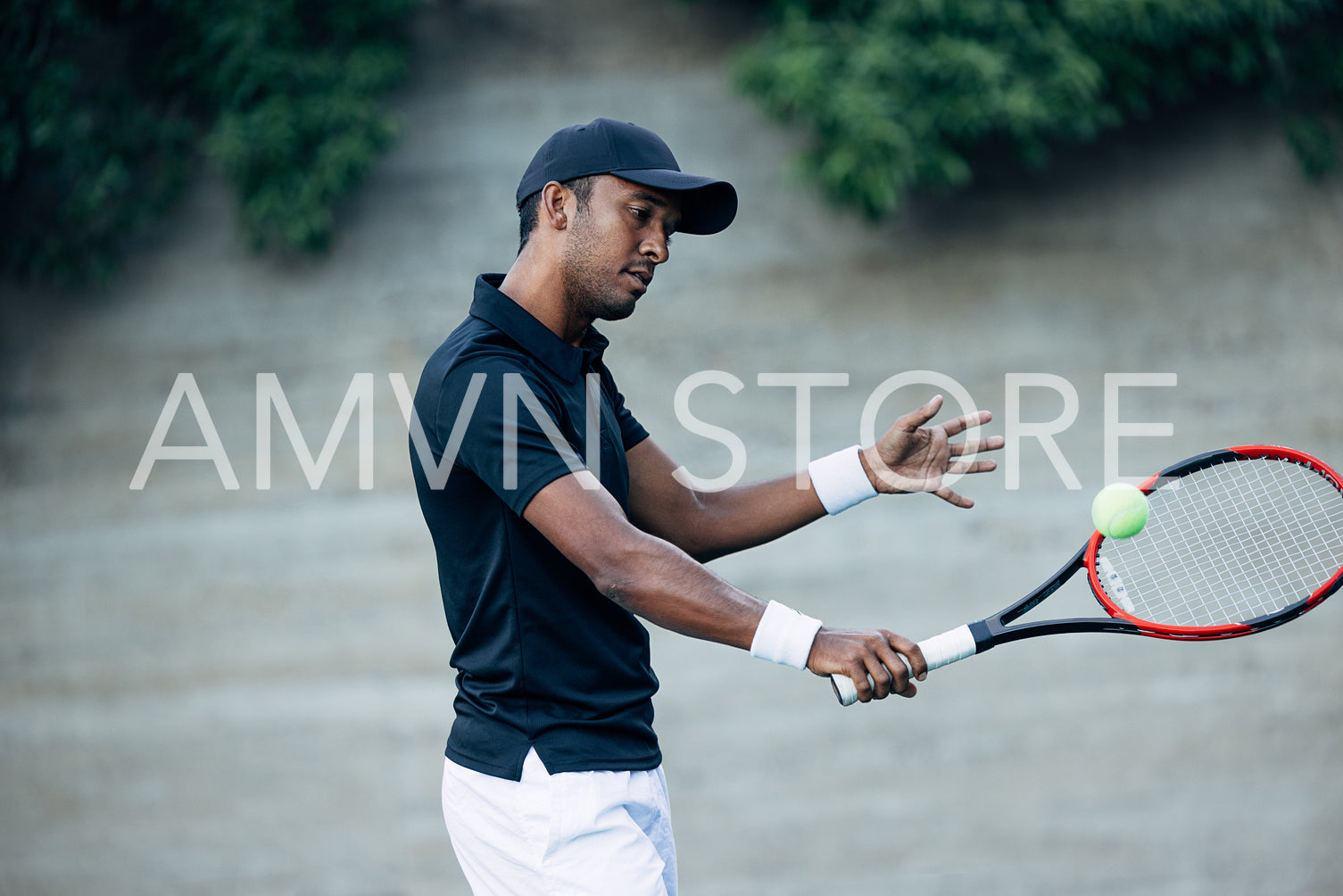 Tennis player with racket practicing outdoors