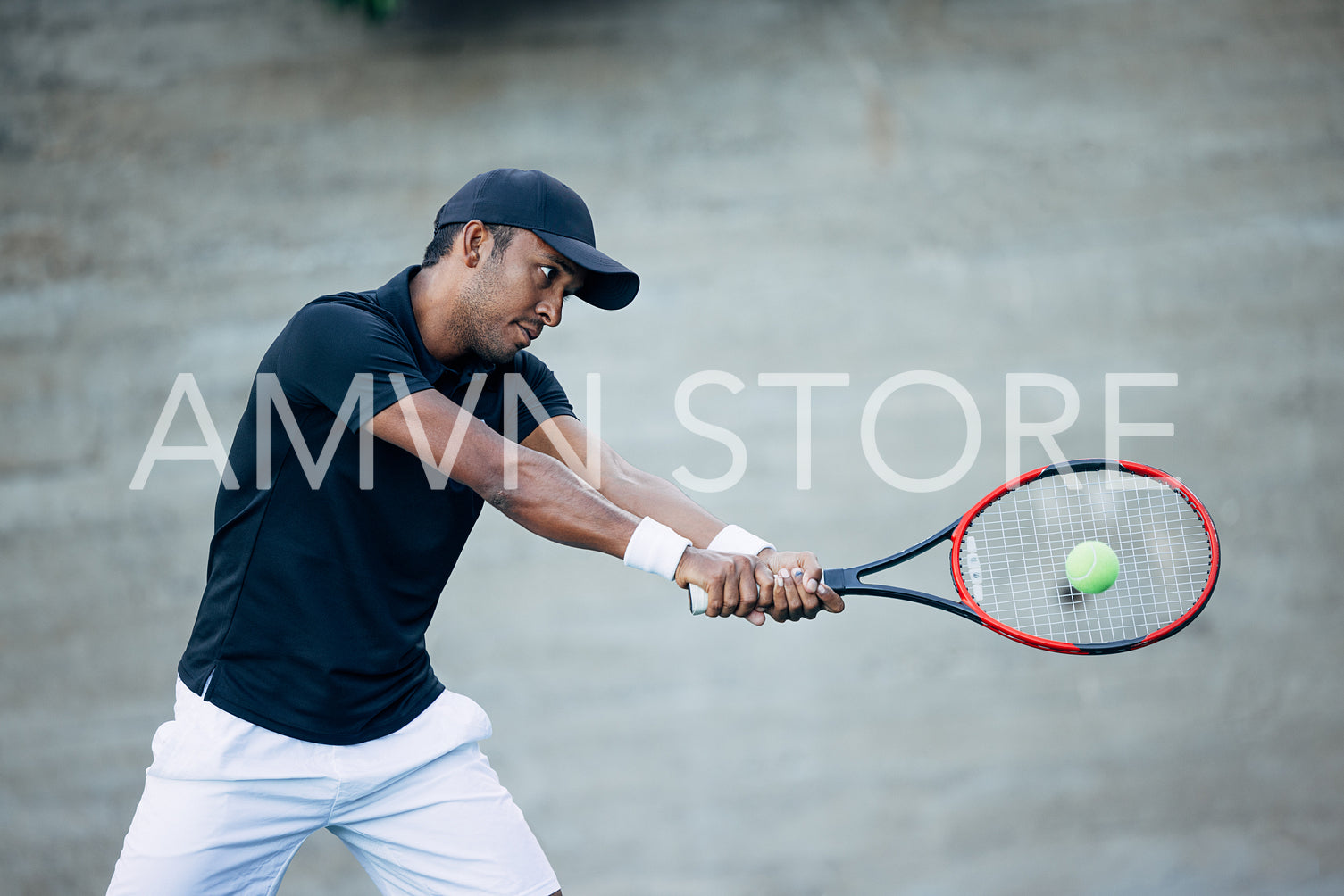 Professional tennis player hitting ball with racket while playing outdoors