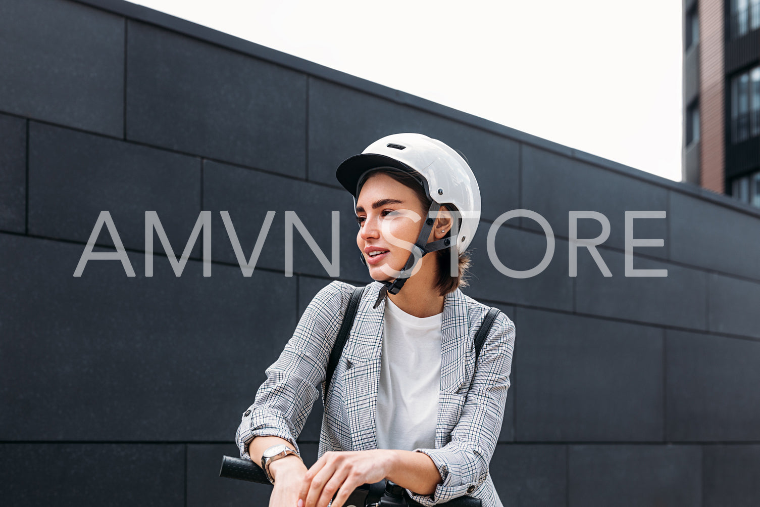 Portrait of young woman wearing safety driving helmet