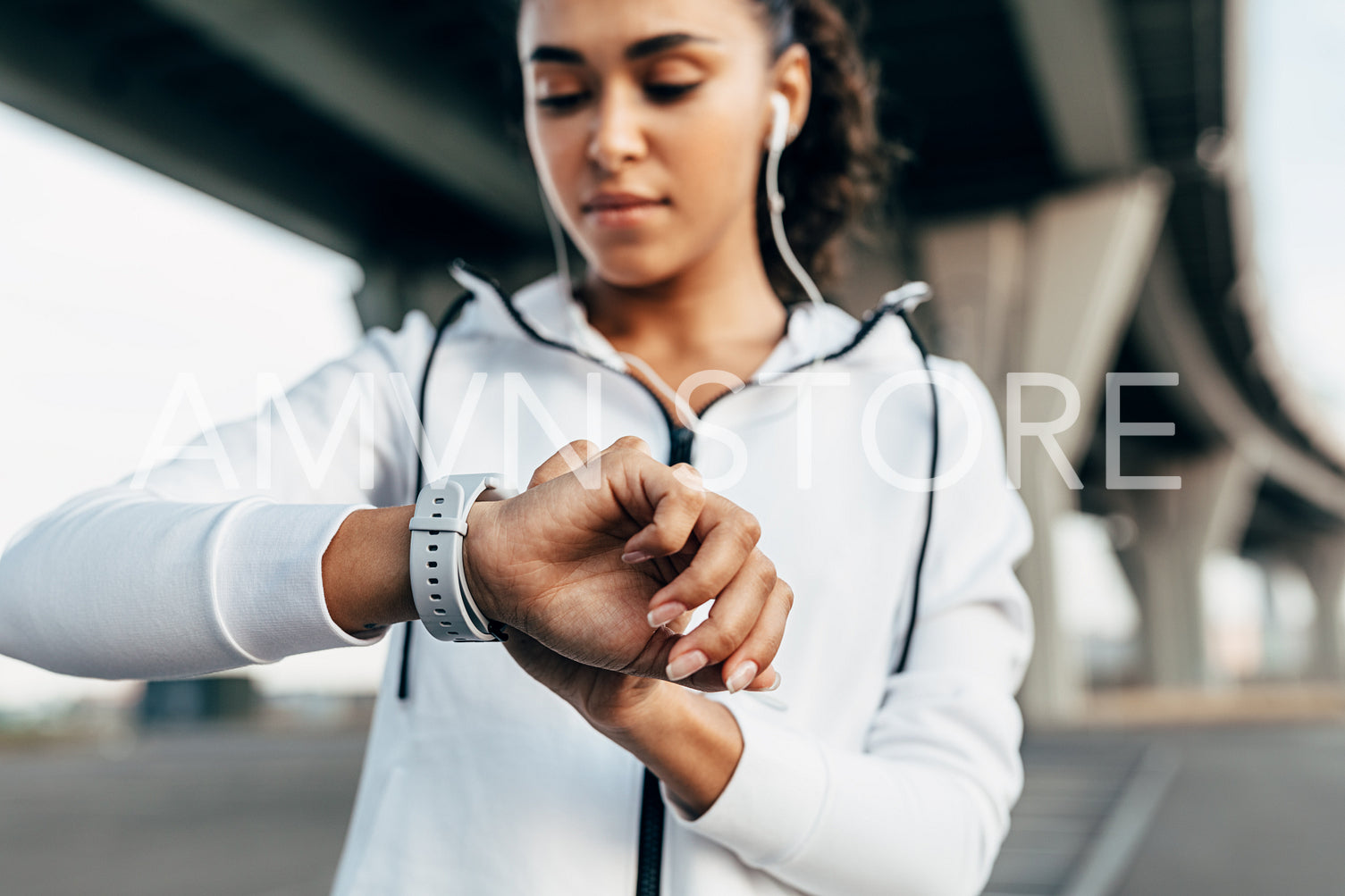 Close up of woman hand with a smart watch. Fit woman looking on activity tracker after work out.	