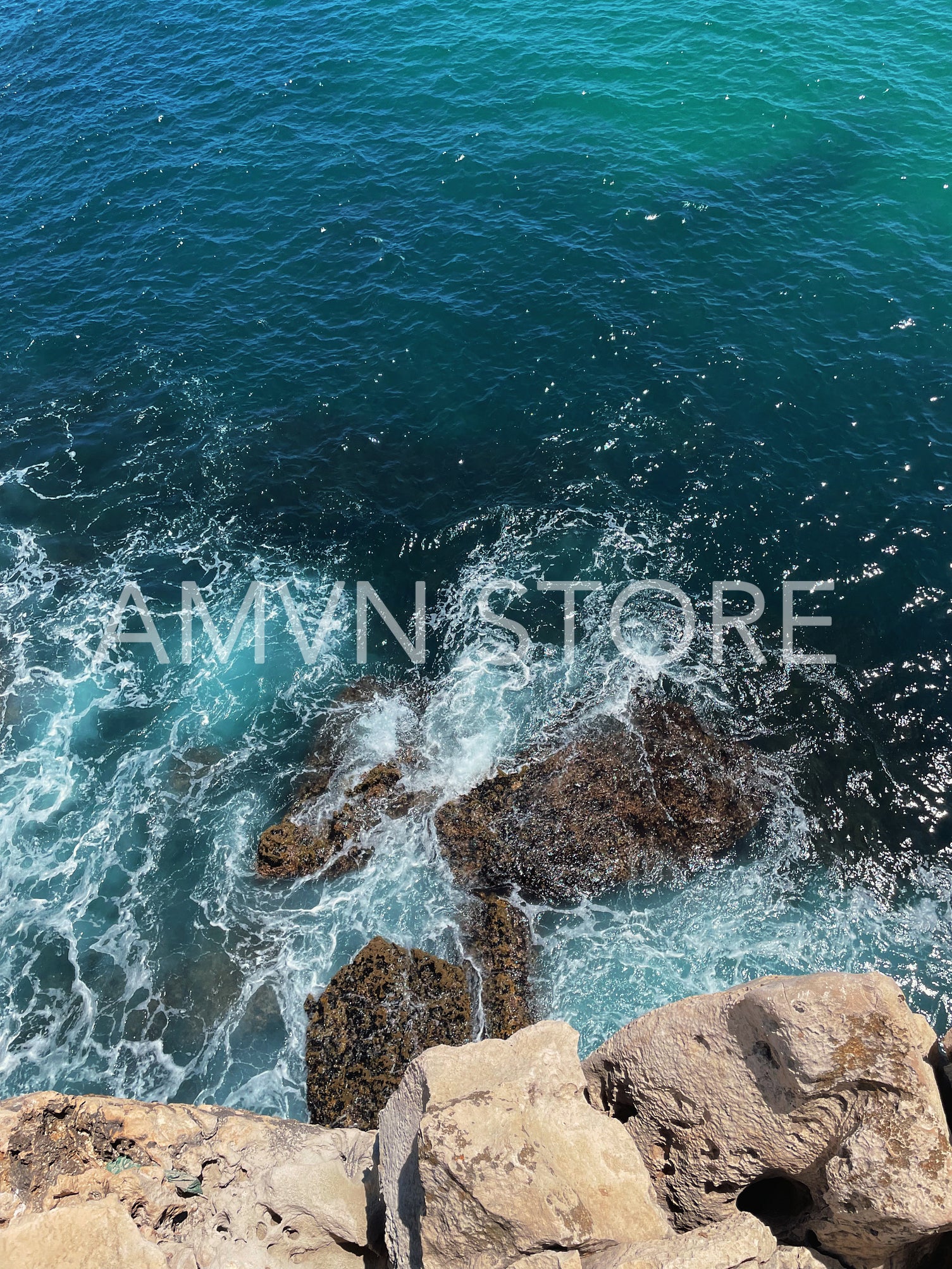 Shot from above on the ocean and rocks