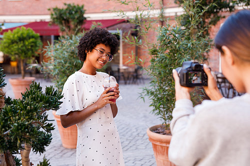 Photographer collaborating with a blogger. Two women creating content for social media.