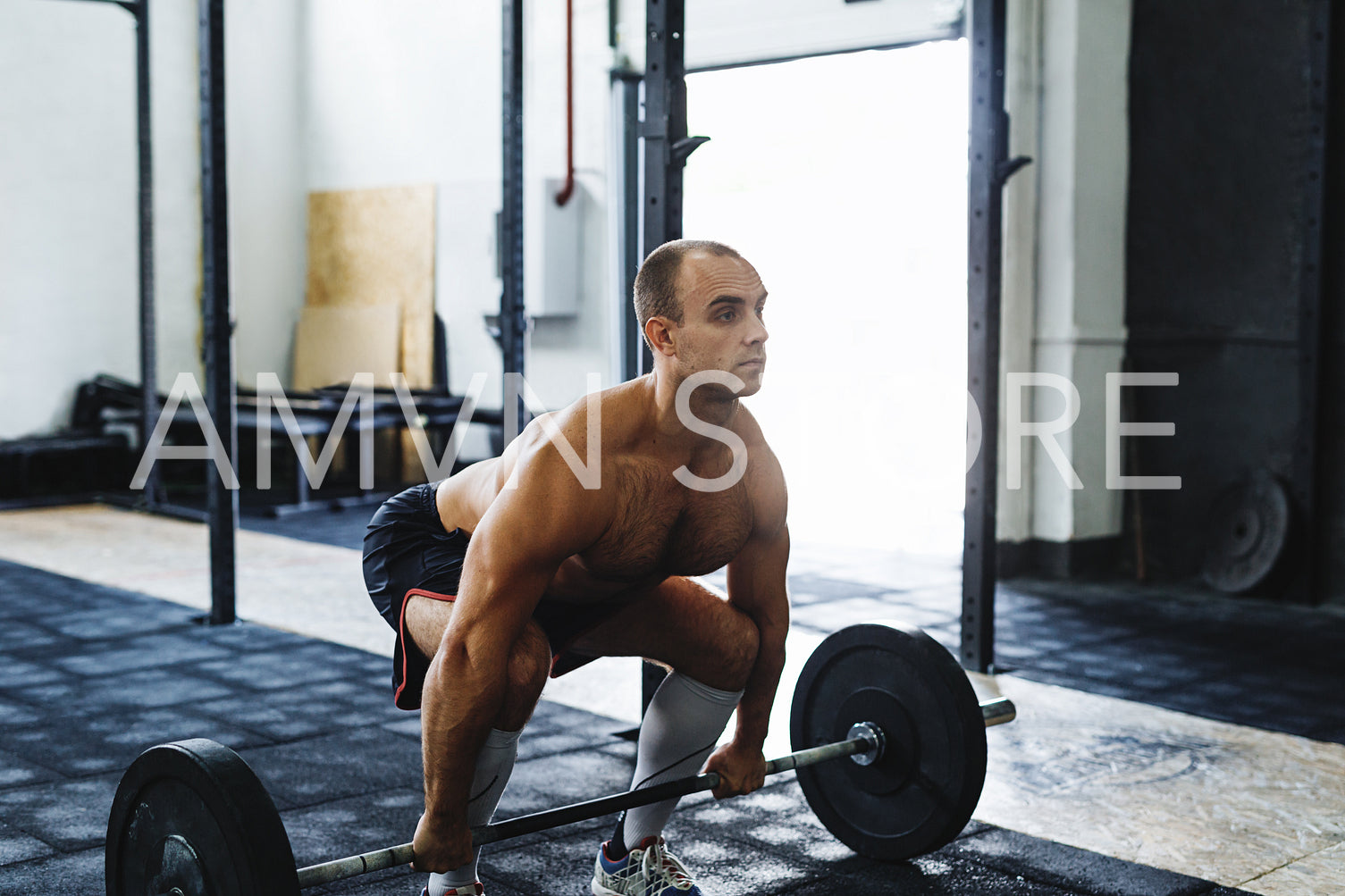 Shot of young bodybuilder working out at gym	