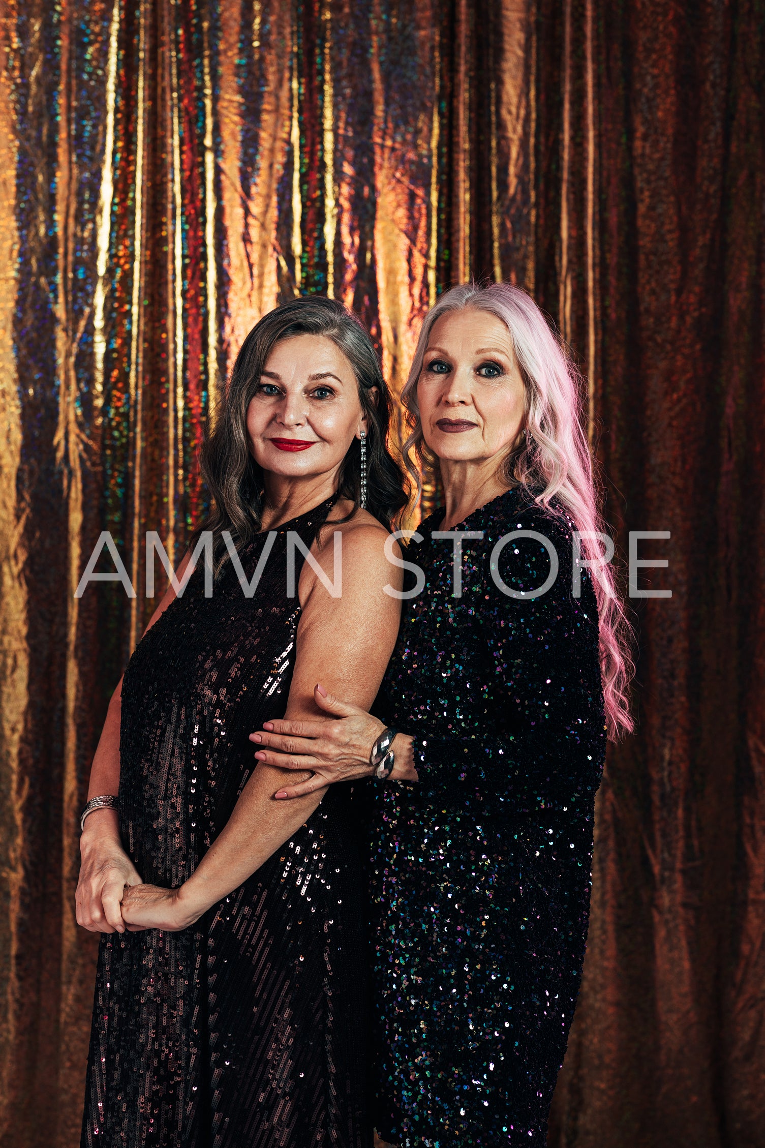 Portrait of two senior girlfriends posing together in the studio