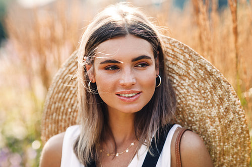 Portrait of a beautiful caucasian woman with straw hat