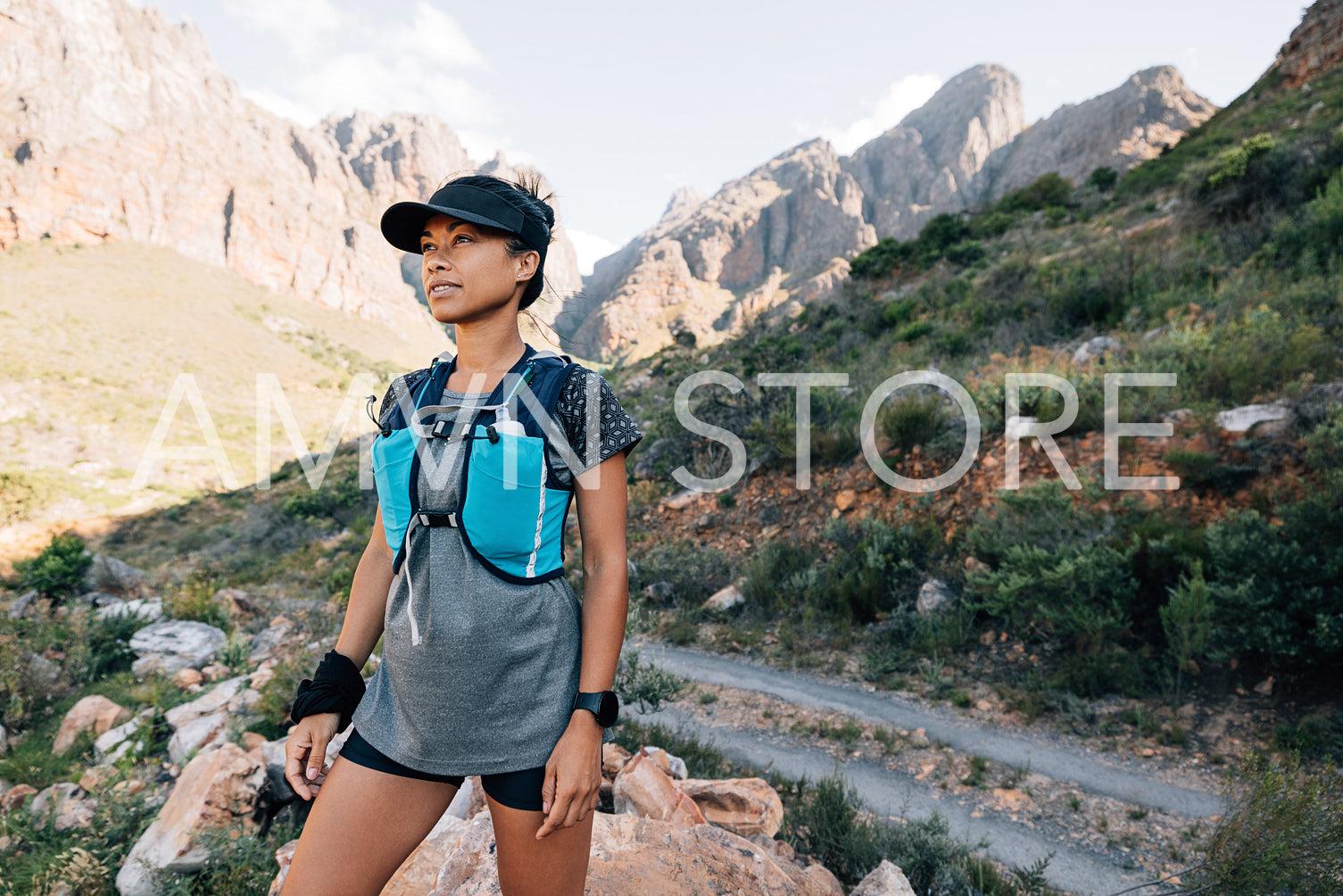 Young woman in sportswear relaxing during hike. Portrait of trai