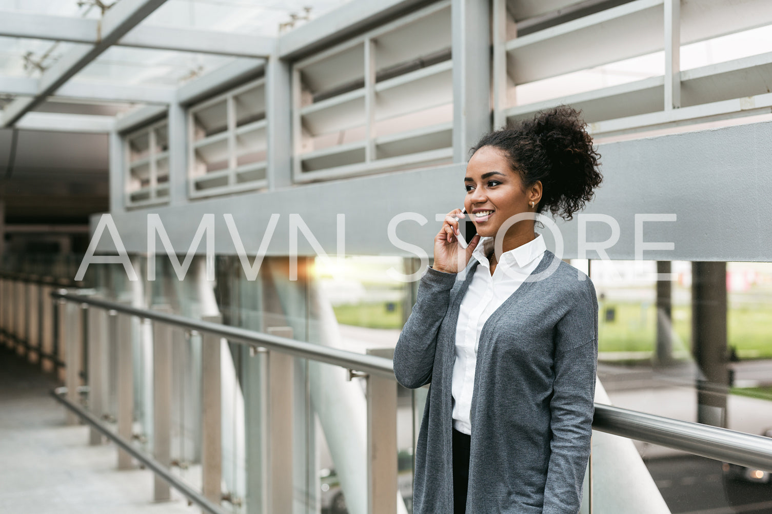 Businesswoman standing in terminal and making phone call	