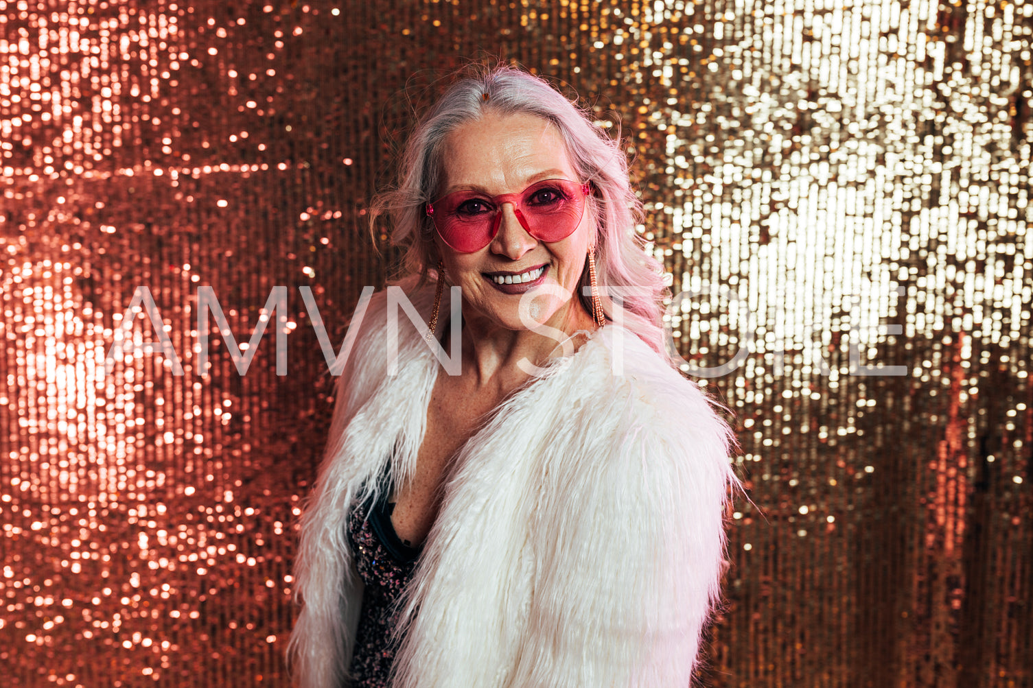 Stylish senior woman in white fur coat wearing pink eyeglasses h