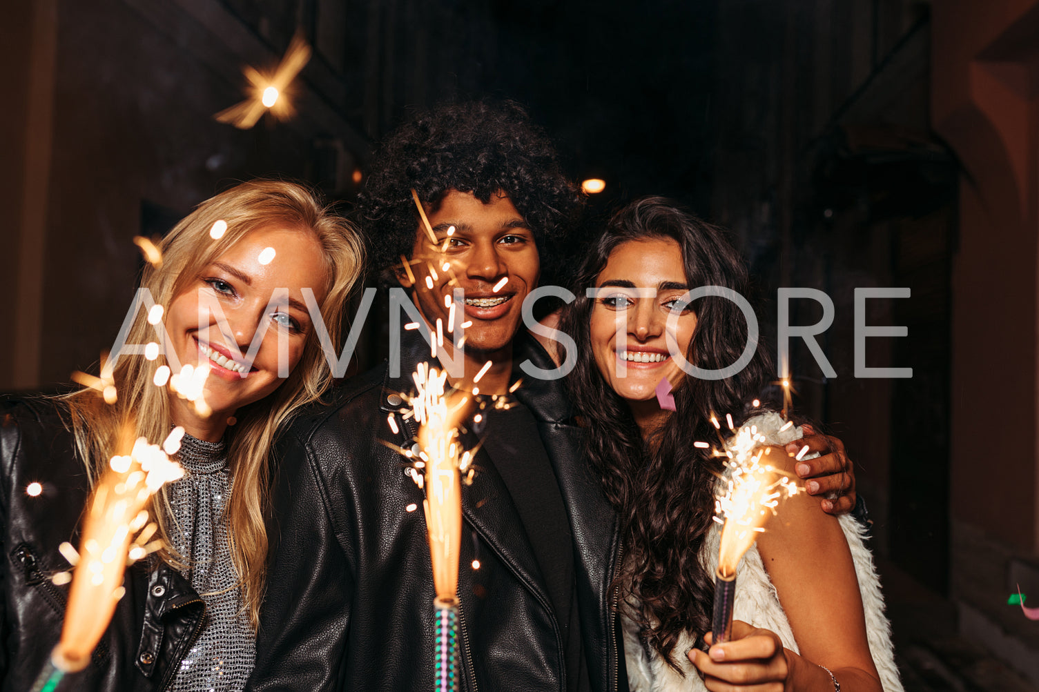 Young man and women enjoying new years eve outdoors	