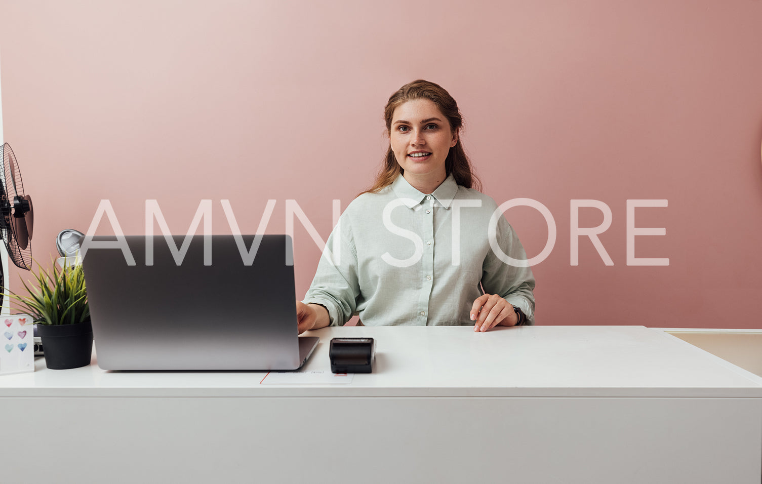 Portrait of a clothing store owner. Smiling woman working in her