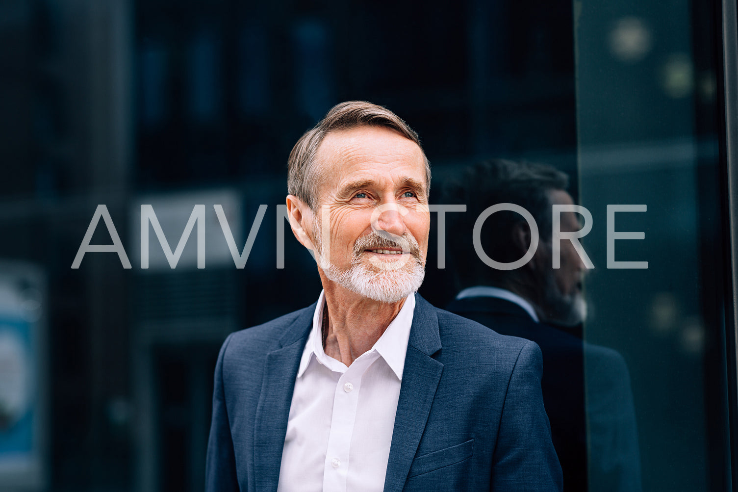 Bearded man wearing suit standing at office building outdoors	