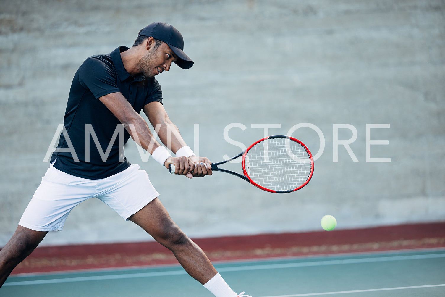 Tennis player receiving the serve. Professional tennis player hitting a ball with a racket.