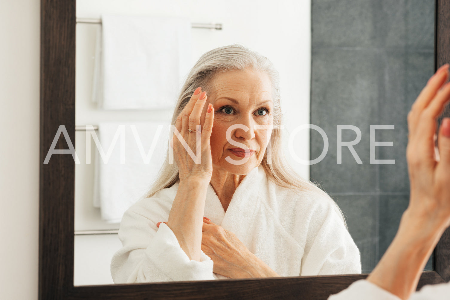 Aged woman looking at a mirror