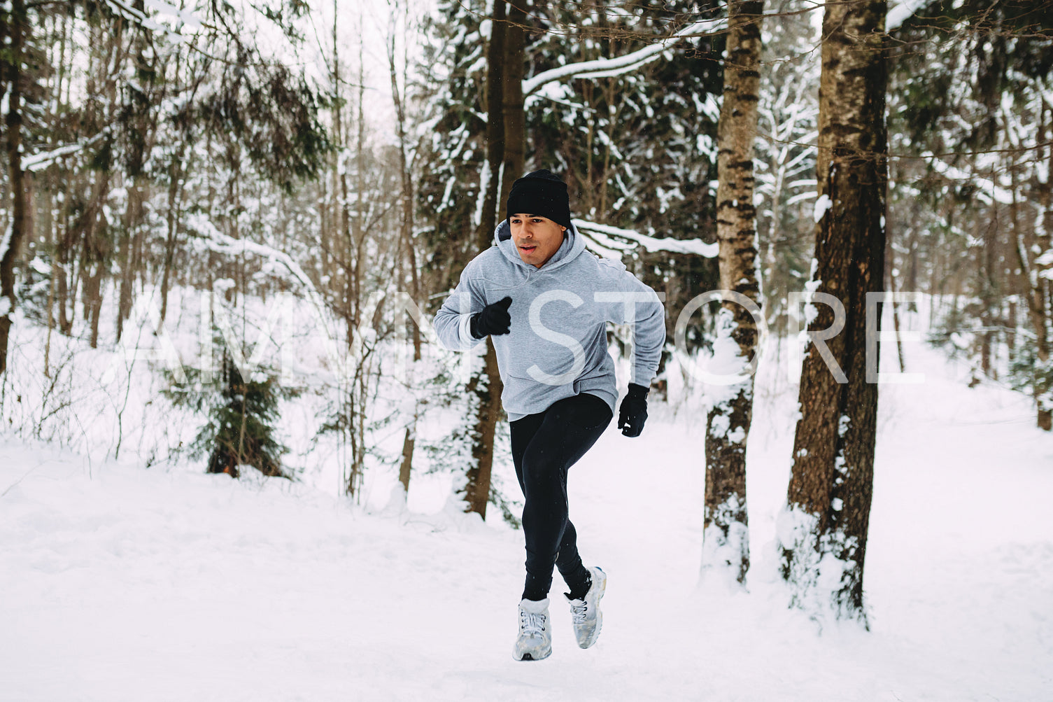 Young man doing morning training. Sportsman running up the hill.	