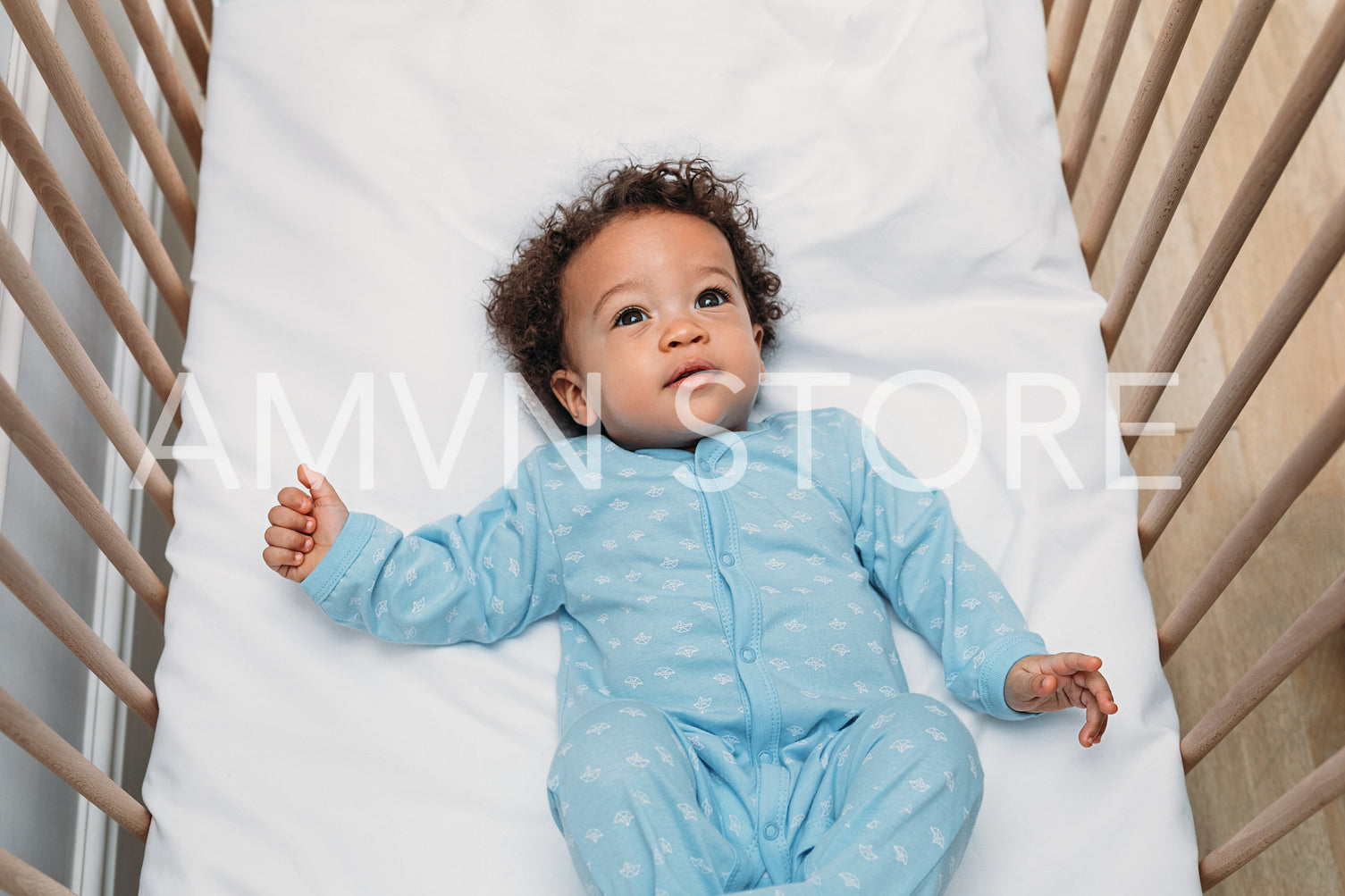 Portrait of a cute baby boy wearing pajamas	