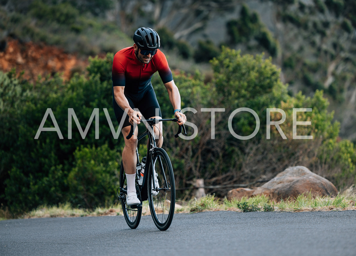 Male road bike rider doing intense and tough training in wild terrain