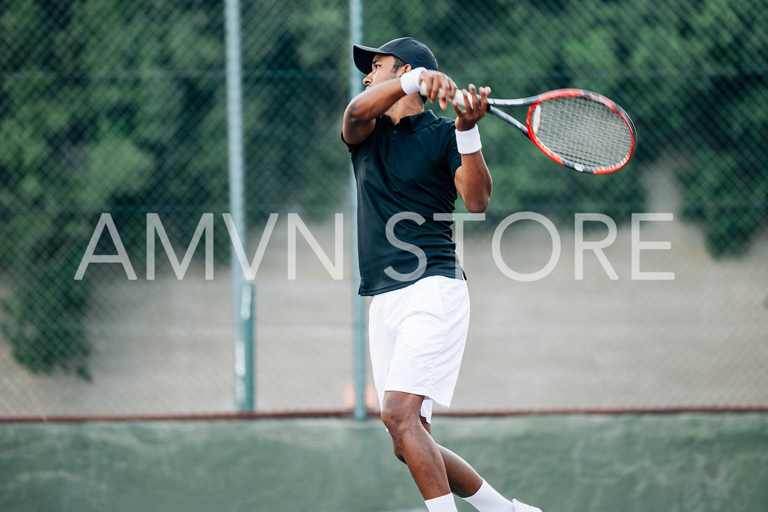 Side view of a professional tennis player returning the serve