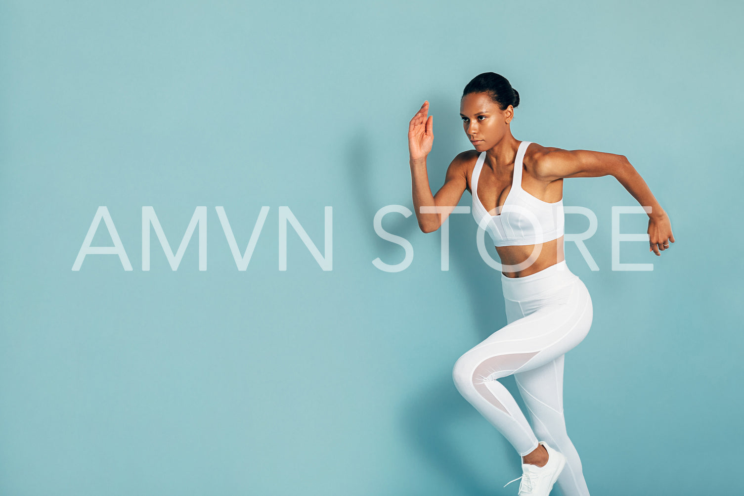 Cropped shot of fitness woman in white sportswear running over blue background	