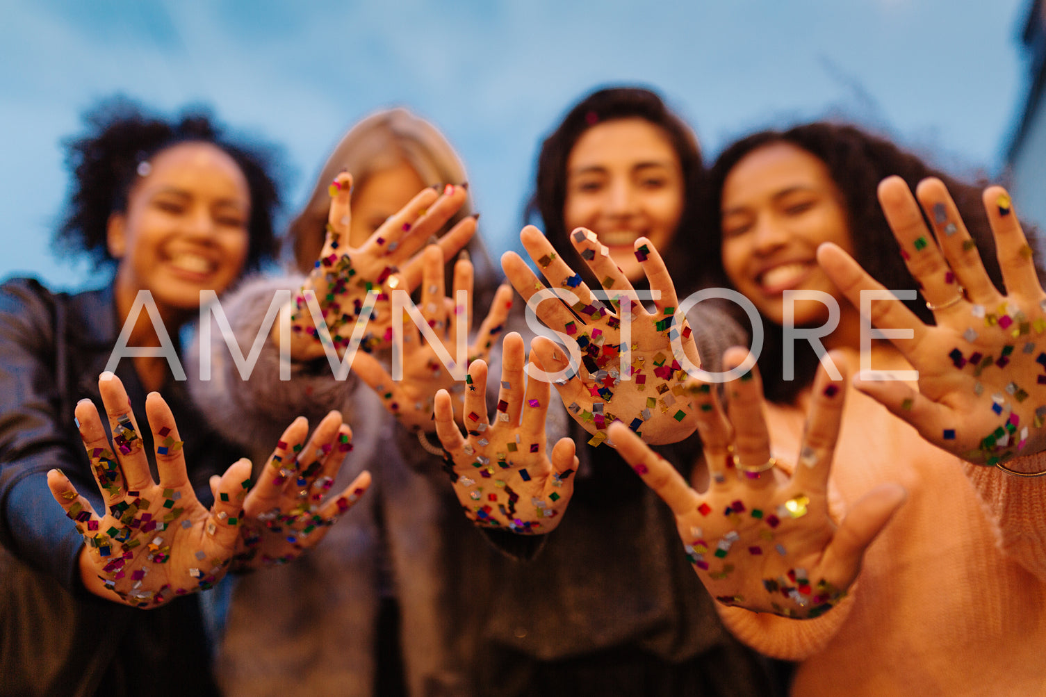 Close up shot of female hands with confetti, showing in camera	