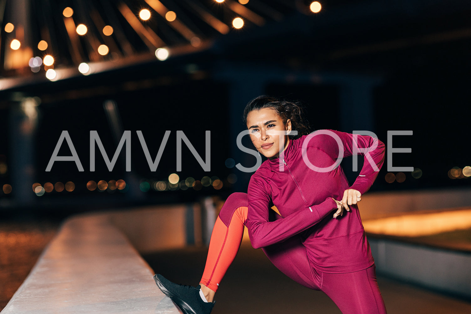 Middle east woman doing flexibility exercises outdoors at night