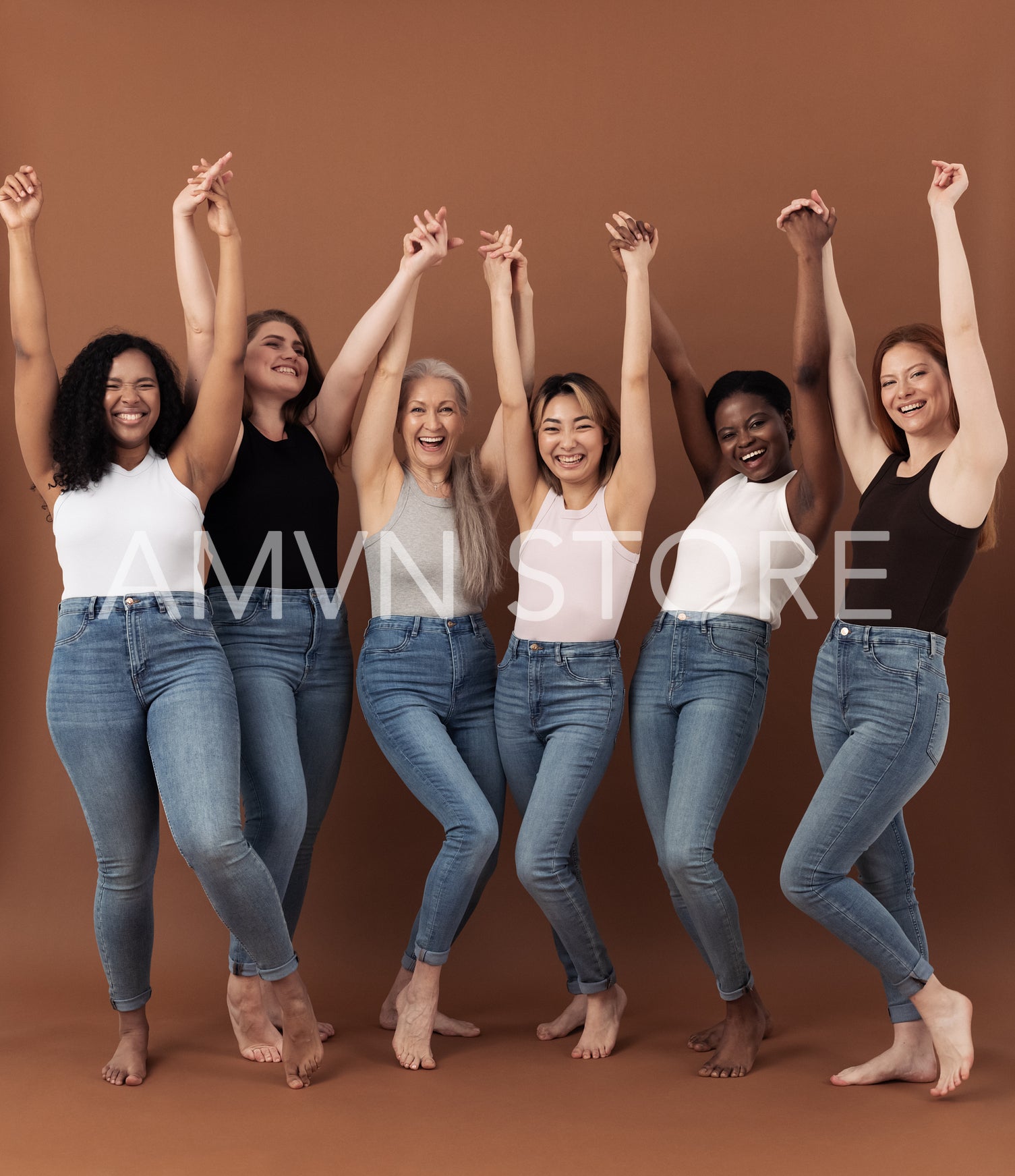 Six happy women raised their hands up together over brown background