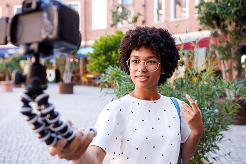 Female vlogger recording shooting video from her vacation